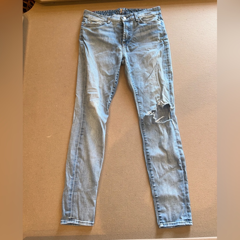 7 For All Mankind jeans with rip in on knee. Size 31!